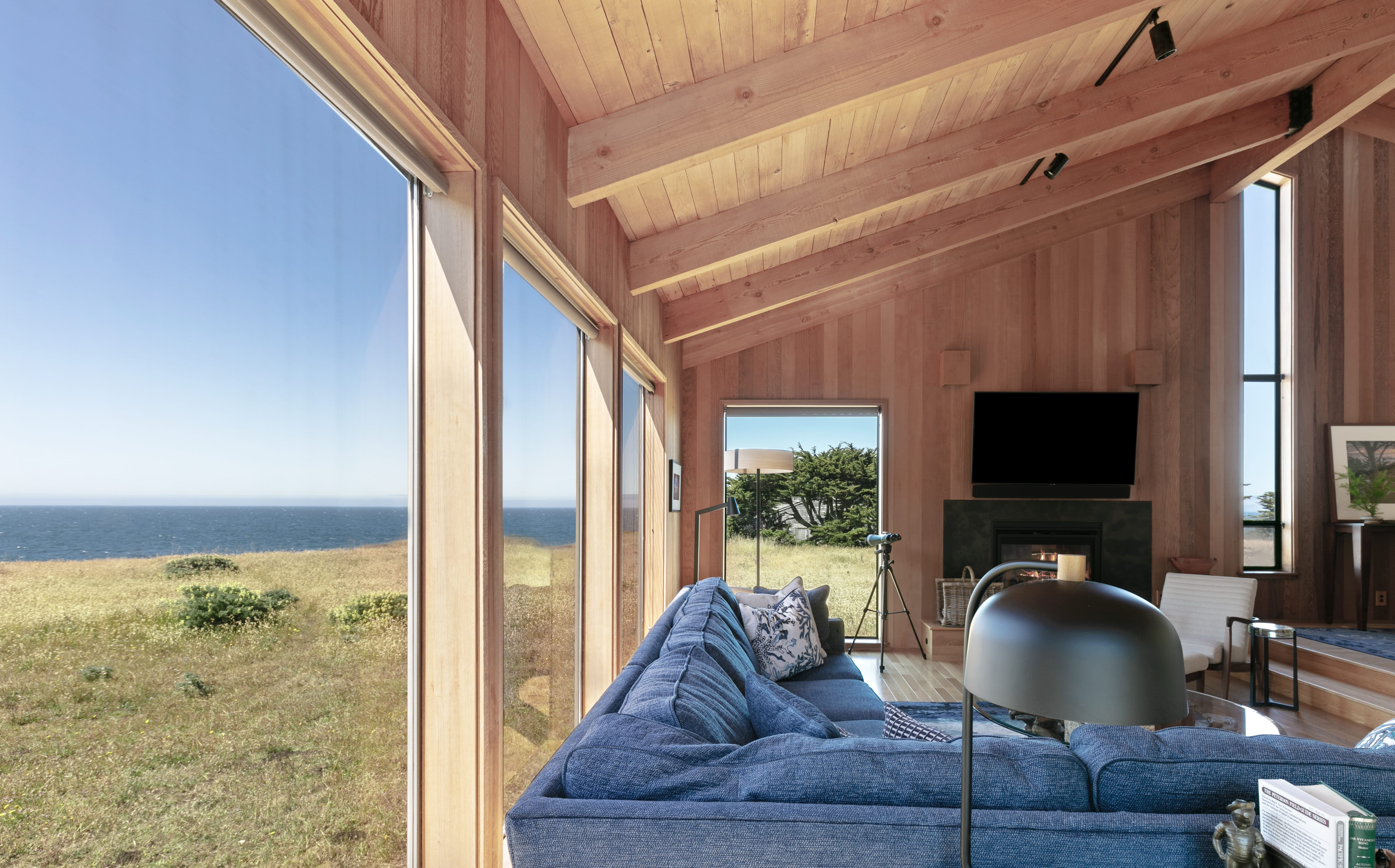 Living room view of Pacific Ocean and ocean bluff trail, a feature of over 50 miles of private and community trails.